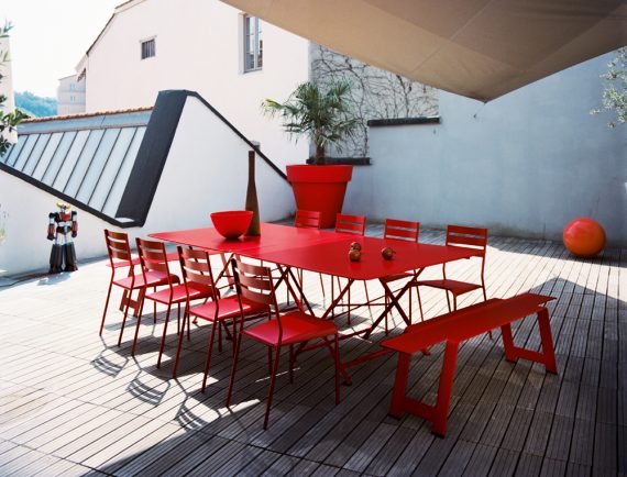 Cargo table (× 2) with Facto chairs and Origami bench, all in Poppy