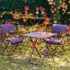 Dune armchairs and Plein Air table in Aubergine