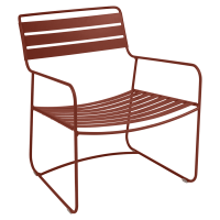 Surprising low armchair in Red Ochre