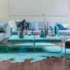 Bellevie armchairs, two seat sofas and low tables in Lagoon Blue with Flannel Grey cushions