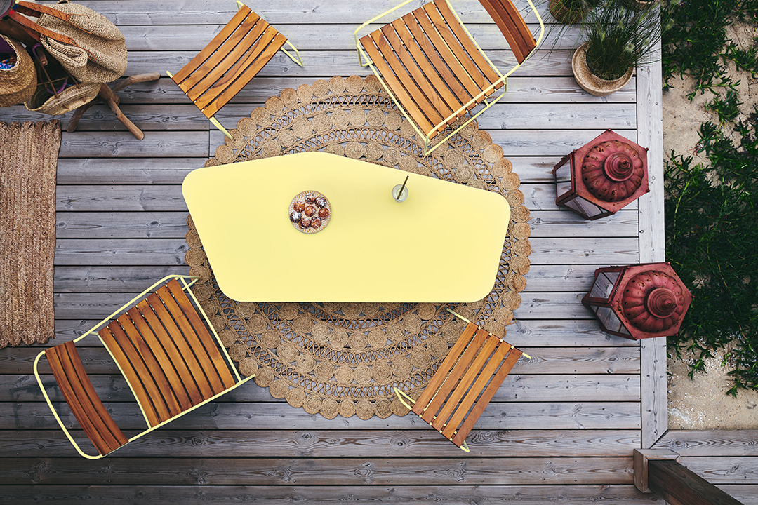 Surprising low armchair teak, Surprising footstool teak, and Ultrasofa low table, all in Frosted Lemon