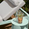 Bebop side table, 35 cm diameter, and Bellevie sun lounger, both in Iced Mint