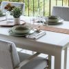 Bellevie dining chair and Bellevie table with storage in Clay Grey
