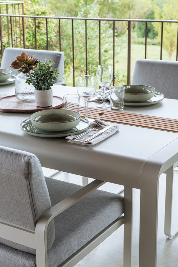 Bellevie dining chair and Bellevie table with storage in Clay Grey