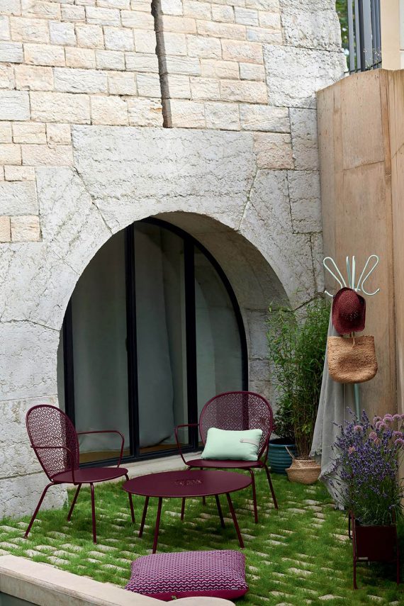 Lorette low armchair and Lorette low table in Black Cherry