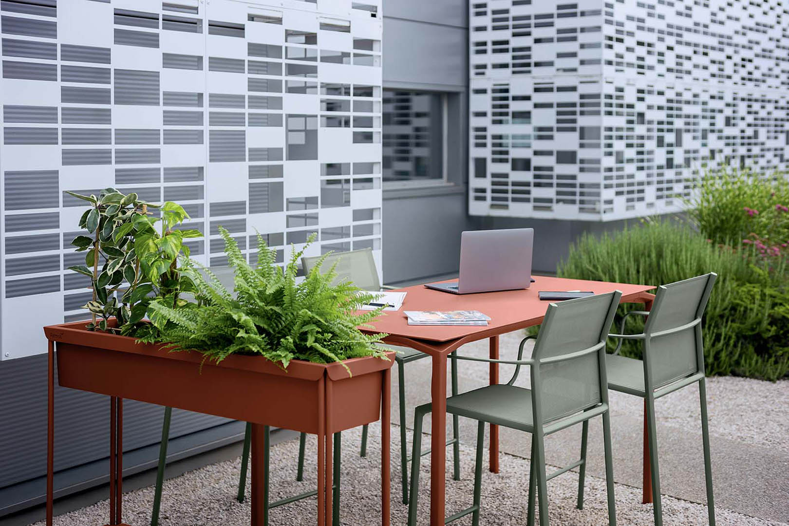 Calvi table in Red Ochre, Cadiz chairs in Rosemary